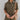 Frontal view of the The Lady May Romper that features an olive green fabric, a collar neckline, a short cuffed sleeve, a button-up front, two front pockets at the chest, a cuffed bottom hem, and two back pockets.