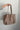 Angela Taupe Suede & Studs Tote - model shown holding tote