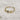 Image shows the Penny Gold Flower Ring against a white background.