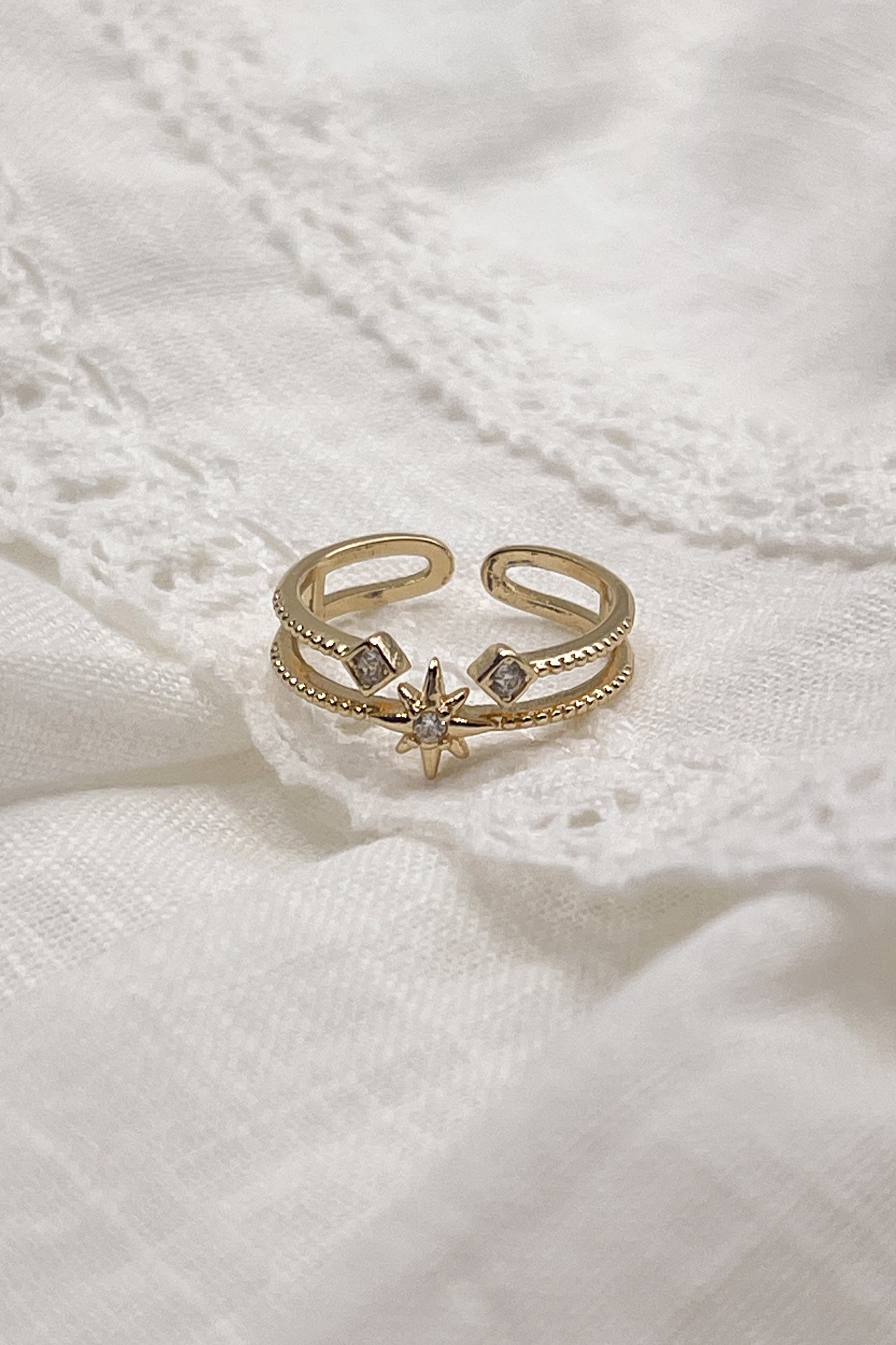 Image shows the Melina Gold & Rhinestone Ring against a white background.