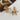 Claudia Gold Floral Earrings - close up flat lay