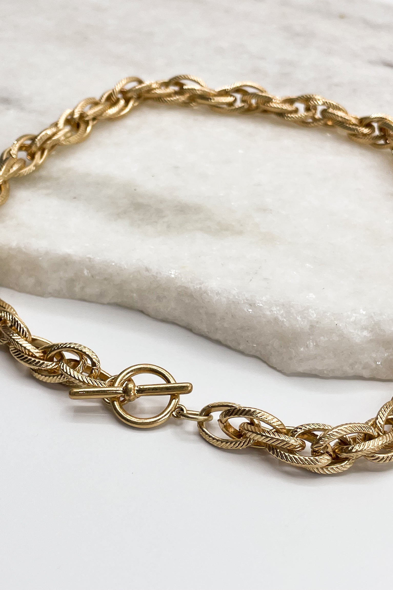 Close up of closure on Ember Gold Texture Necklace, adjustable gold texture chain necklace.