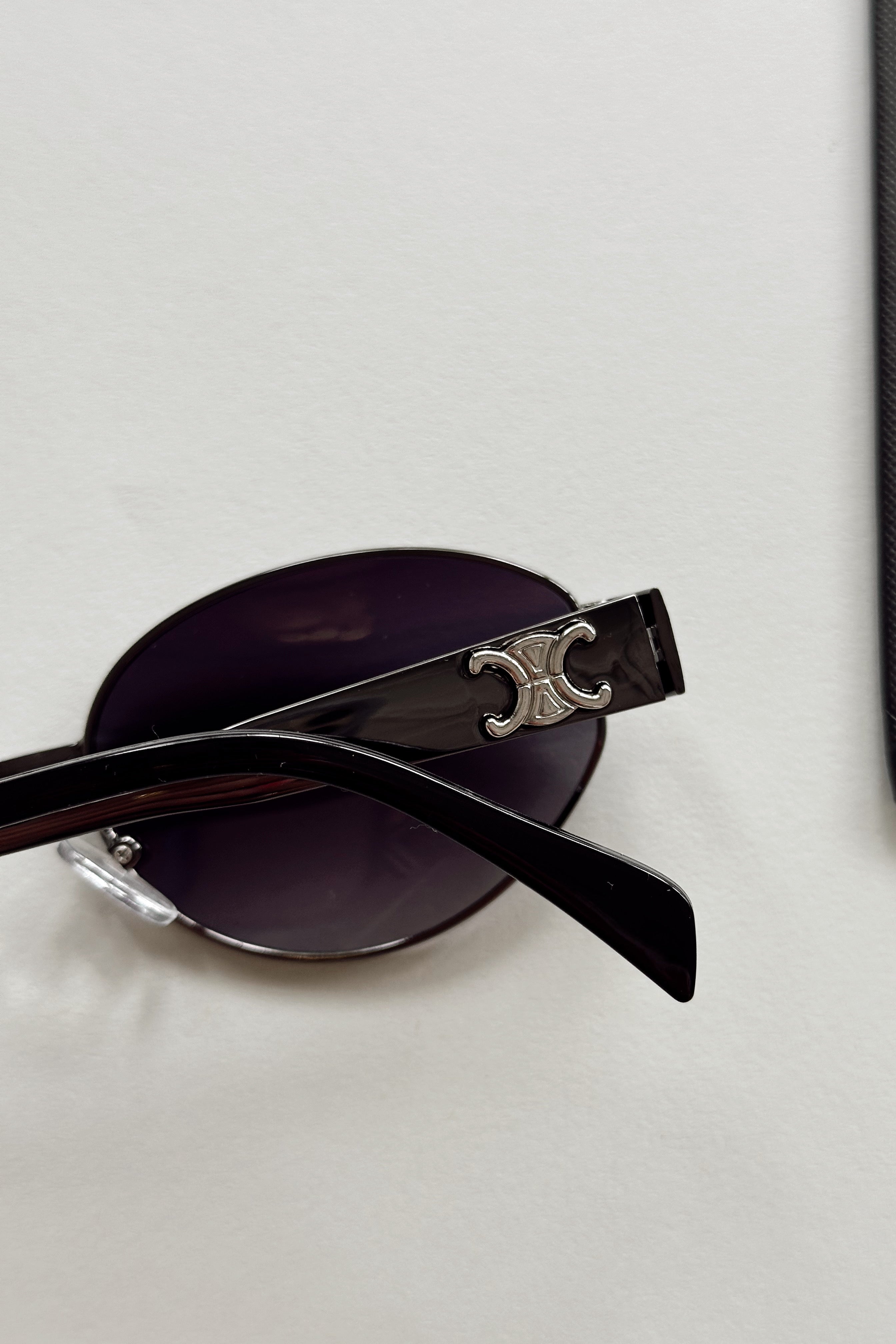 Clarissa Sunglasses in Black - flat lay - close back view