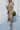 Front view of model wearing the Change of Heart Midi Dress, which features a satin material, a multi-colored floral print, a collared V surplice neckline, short cuffed sleeves, a tie waist, and a midi length
