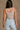 Back view of female model wearing the Kendall Ribbed Longline Brami in Khaki which features Ribbed Fabric, Washed Details, Longline Waist, Round Neckline, Thick Straps and Sleeveless