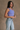 Side view of female model wearing the Kendall Ribbed Longline Brami in Purple which features Ribbed Fabric, Washed Details, Longline Waist, Round Neckline, Thick Straps and Sleeveless