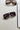 Kennedy Sunglasses in Black - flat lay -  front view