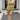 Full body view of female model wearing the Natalia Moss Green Ruffle Short Sleeve Romper which features Olive Green Lightweight Fabric, Ruffle Tiered Shorts, Smocked Waistband, Ruffle Hem Details, Square Neckline and short Sleeves