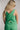Back view of female model wearing the Jade Green Criss-Cross Back Tank which features Green Lightweight Fabric, Square Neckline, Overlap Back Details and Thick Straps