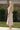 Full body side view of female model wearing the Everly Light Taupe Ribbed Sleeveless Midi Dress which features Light Taupe Ribbed Fabric, Midi Length, Slit On The Side, Round Neckline and Sleeveless