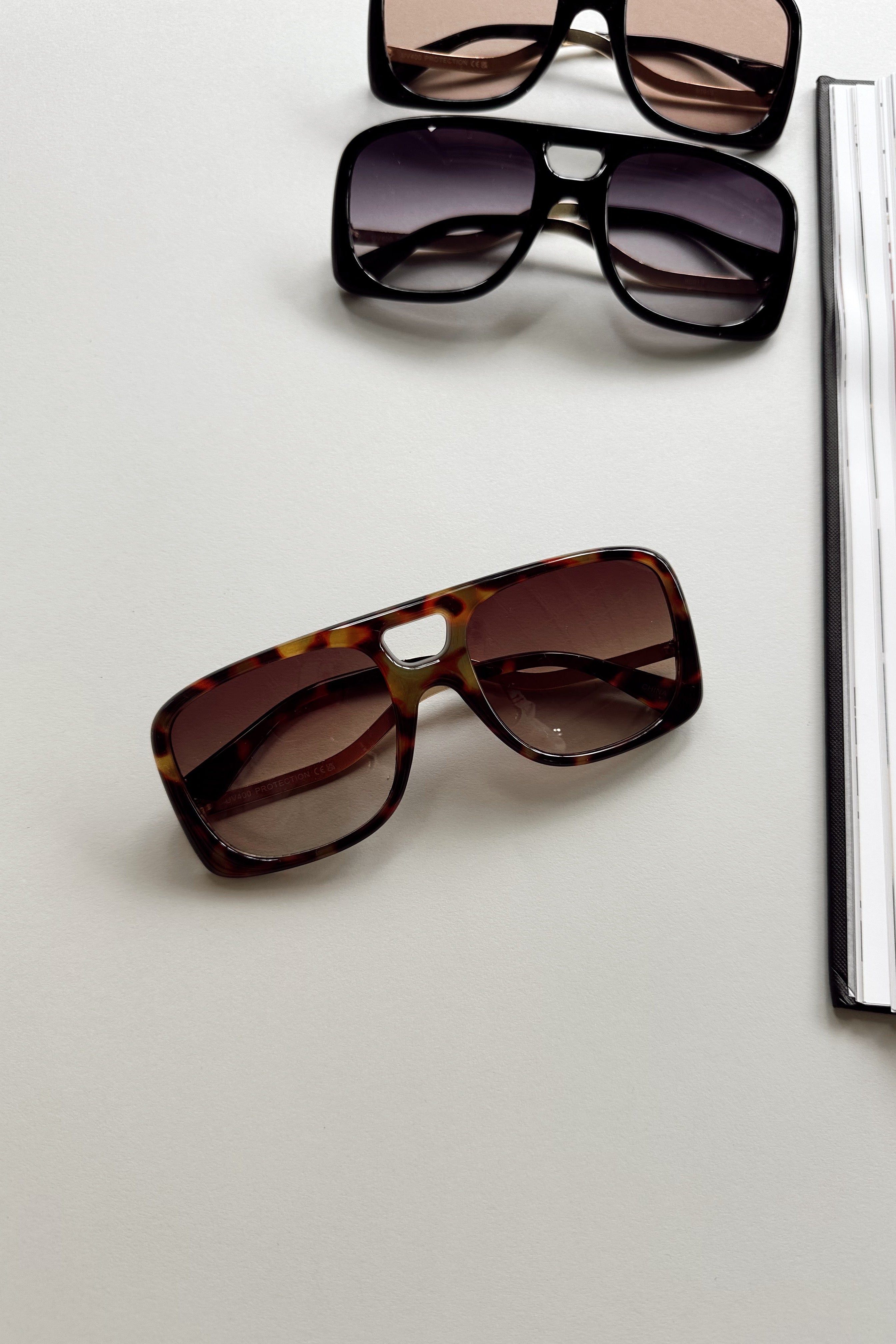 Kennedy Sunglasses in Dark Tortoise - flat lay - front view