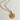 Image shows close-up of the Celeste Gold Star Medallion Necklace against a white background. Necklace has gold chain with circle medallion which has an 8 point star in the center.