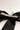 Back view of the Harper Sheer Hair Bow Barrette in Black which features black sheer fabric, textured trim details, triple bow with a french barrette clip.