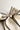 Back view of Felicity Hair Bow Barrette in Ivory/Black which features ivory fabric with black fabric trim, double bow with a french barrette clip