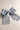 Flat lay view of Felicity Hair Bow Barrette in Baby Blue which features baby blue fabric, double bow with a french barrette clip