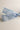 Close up view of the Amelia Sheer Hair Bow Barrette in Light Blue which features light blue sheer fabric, light blue satin trim, double bow with a french barrette clip.