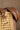 Lola Brown & Gold Faux Leather Belt close  front view of belt on chair