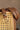 Lola Brown & Gold Faux Leather Belt - front view of belt on chair