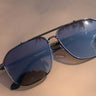 Regan Sunglasses in Black & Blue - close up flat lay