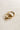 Close up side image of the Ava Gold Knot Hoop Earrings that feature small gold hoops with a knot design and clasp closure, shown on cream paper..