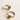 Close up side image of the Ava Gold Knot Hoop Earrings that feature small gold hoops with a knot design and clasp closure, shown on cream paper..