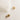 Close up detailed view of the Grace Gold Cross Stud Earring which features mini gold, open cross shaped huggies with hobnail design.