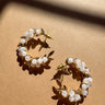 Carolina Beaded Gold Leaf Hoop Earrings - flat lay top view