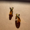 Greer Gold & Silver Criss Cross Stud Earrings - flat lay close up