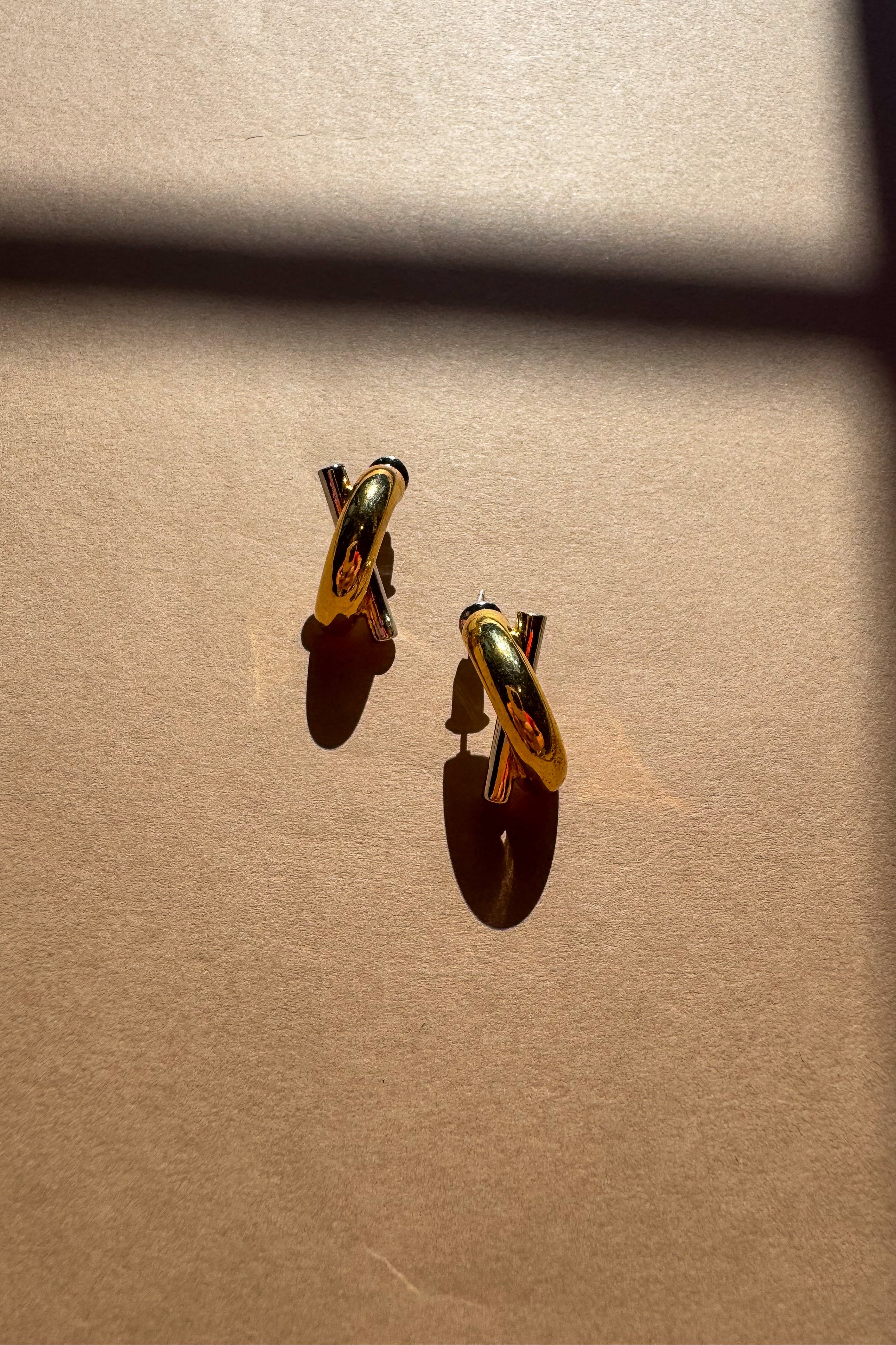 Greer Gold & Silver Criss Cross Stud Earrings - flat lay top view