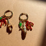 Delphine Coastal Huggie Earrings - flat lay close up