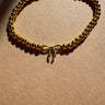 Carmen Gold Beaded Bow Bracelet - flat lay close up
