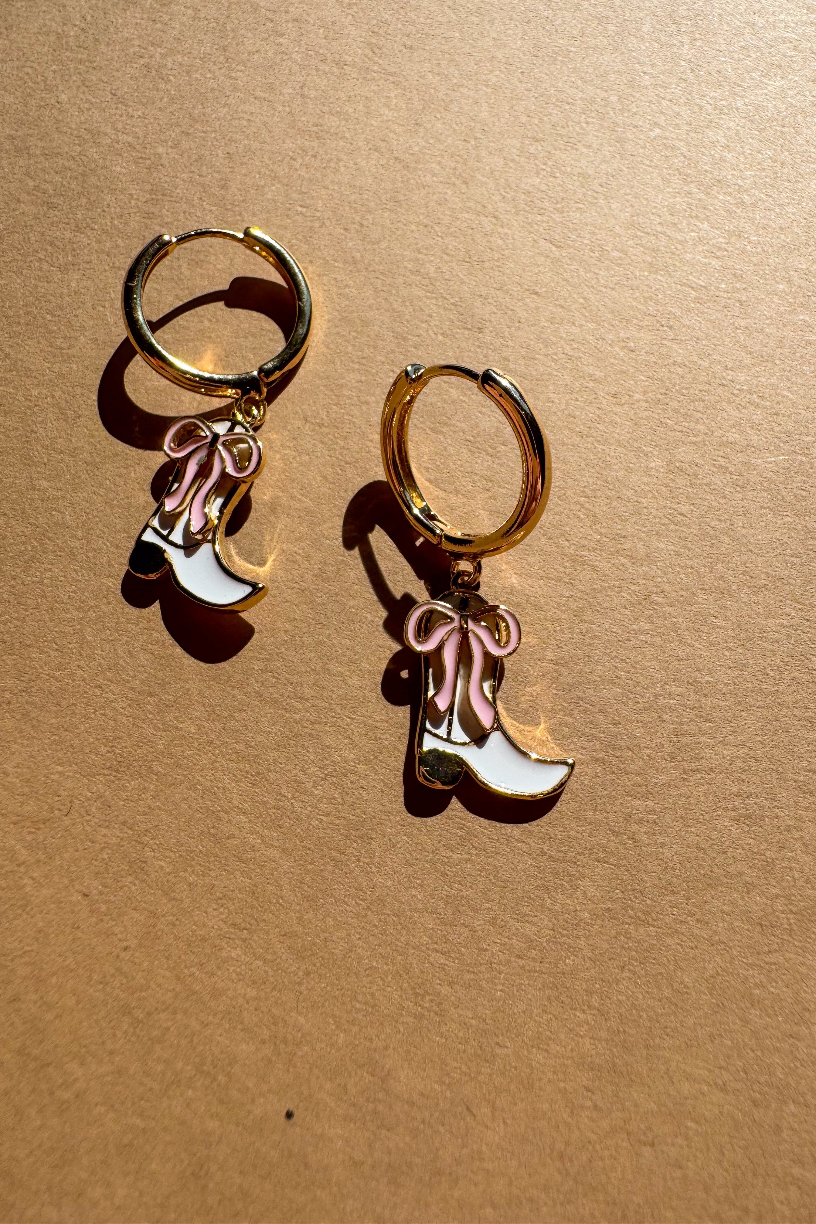 Kimberly Cowgirl Boot Huggie Earrings - flat lay close up