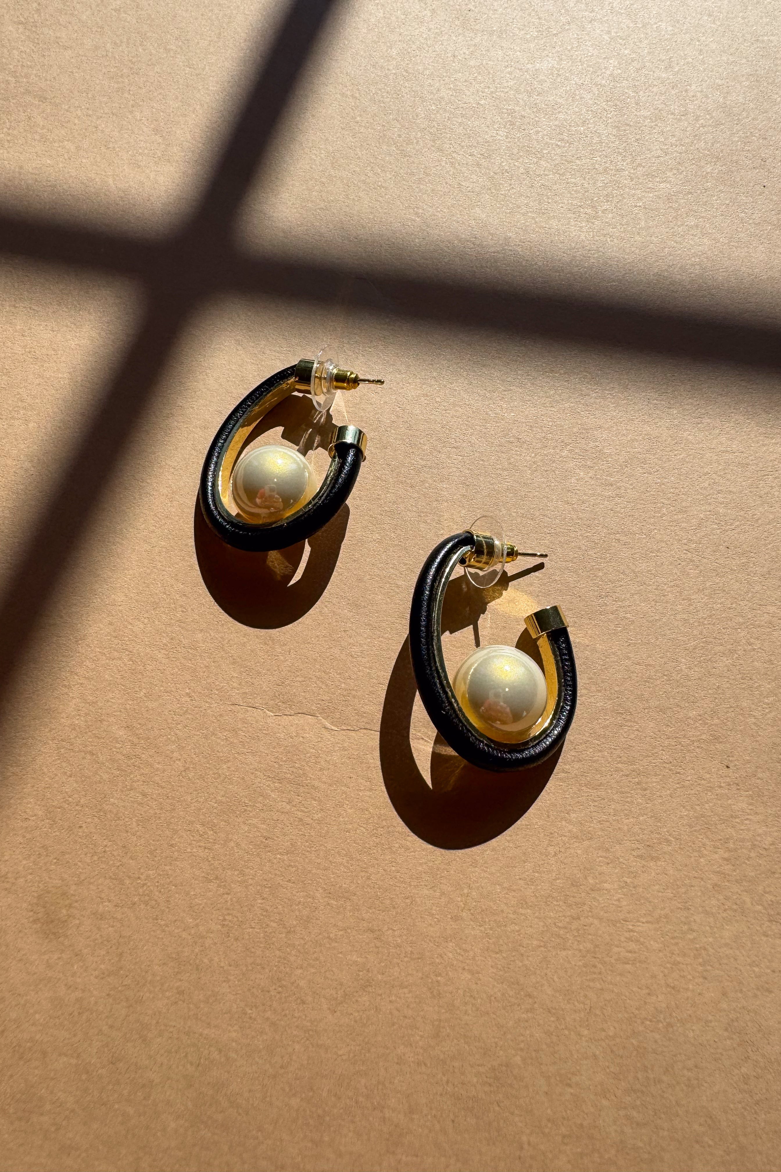 Hattie Black & Gold Scooped Hoop & Pearl Earrings - flat lay top view