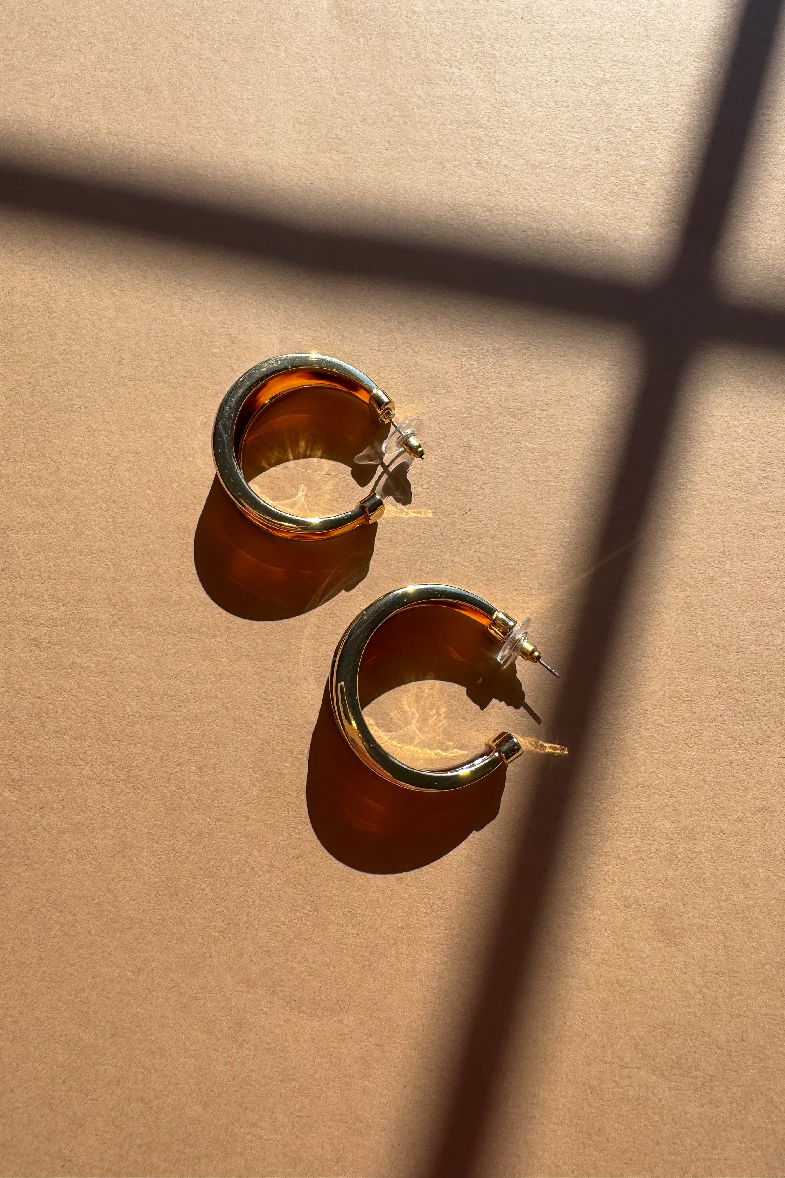 Helena Tortoise Hoop Earrings - flat lay side views