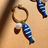 Nora Blue Fish & Pearl Hoop Earrings - flat lay close up