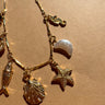 Genevieve Gold Coastal Charm Bracelet - flat lay close up