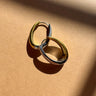 Zelda Gold & Silver Oval Hoop Earrings - flat lay close up