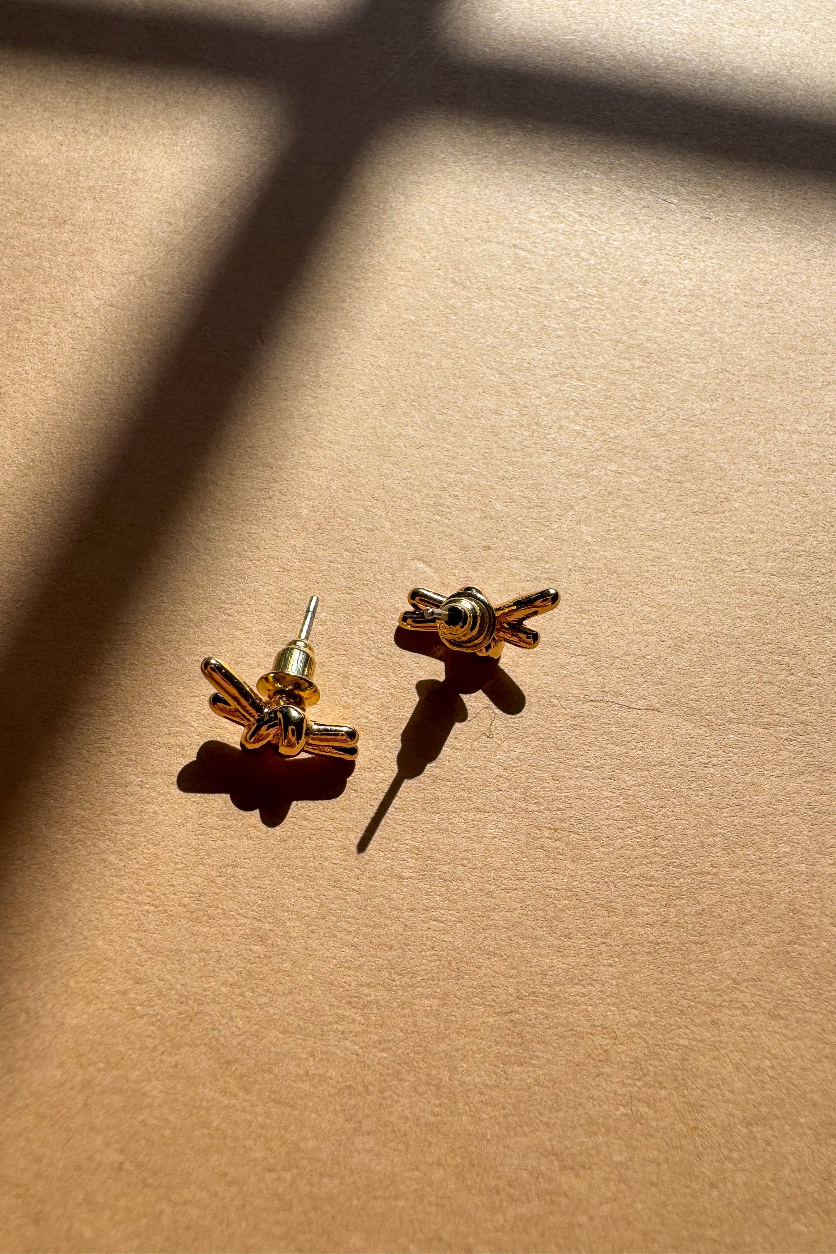 Ivy Gold Knot Stud Earrings - flat lay back view