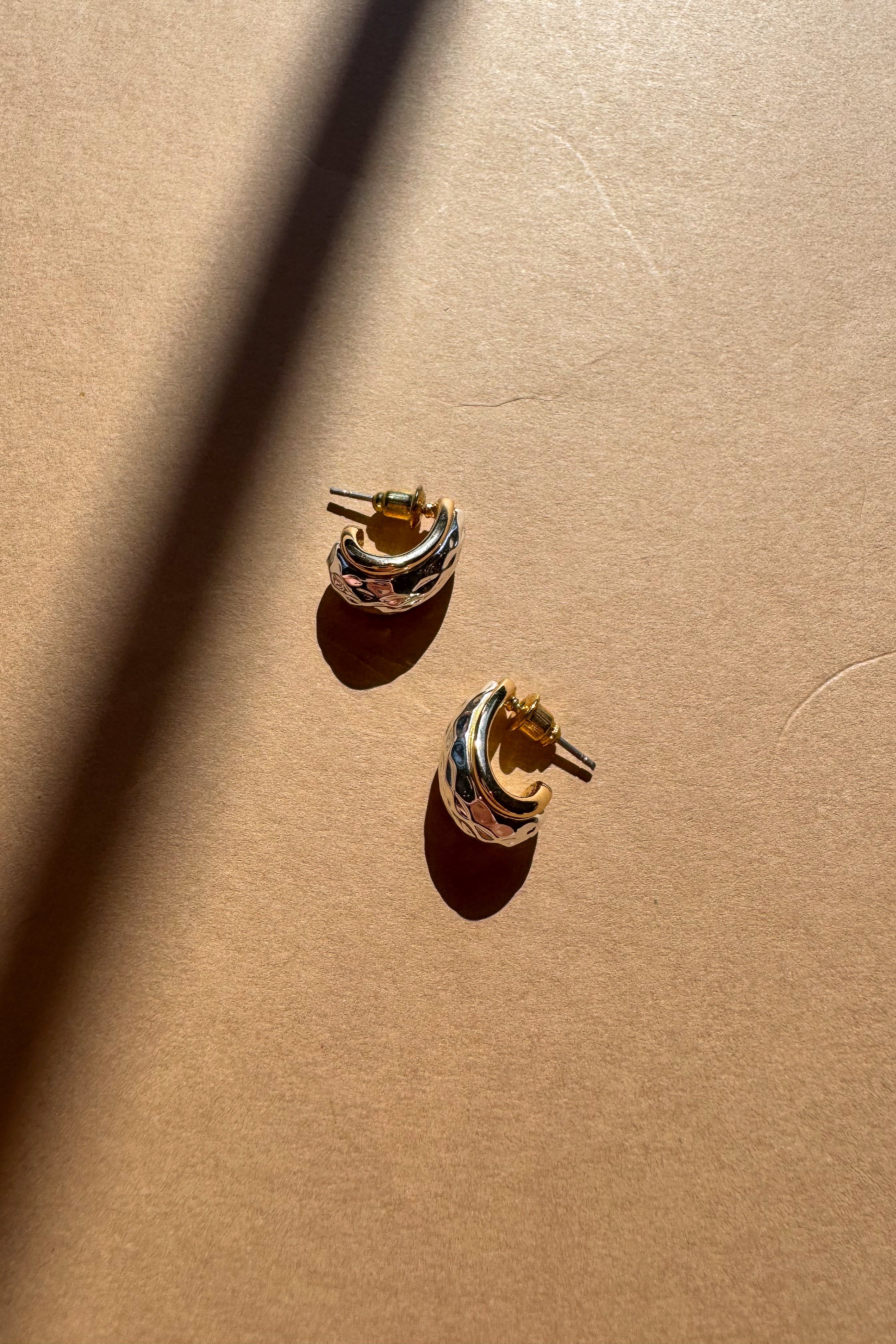 Giada Hammered Silver & Gold Scooped Earrings - flat lay top 