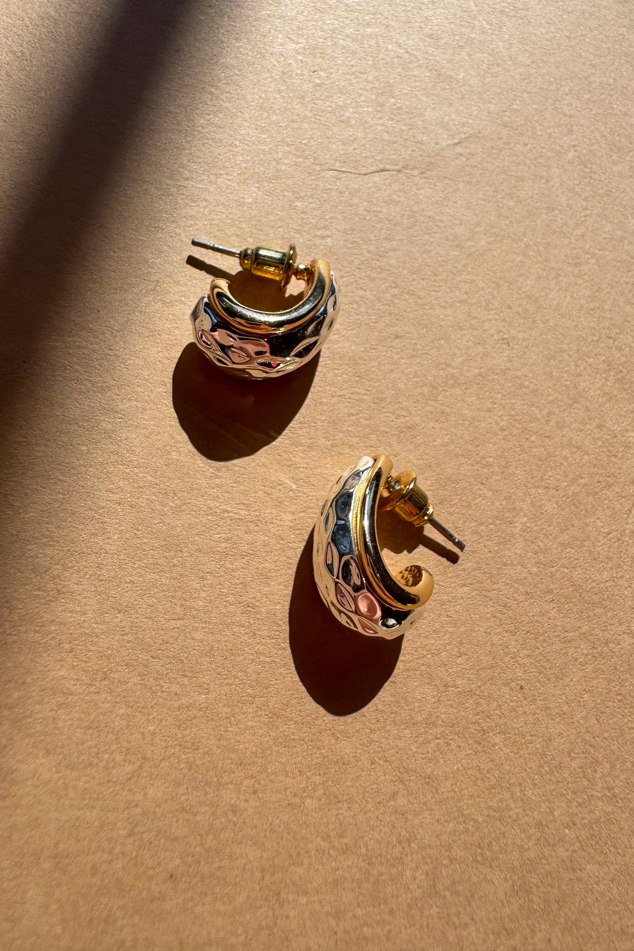 Giada Hammered Silver & Gold Scooped Earrings - flat lay close up