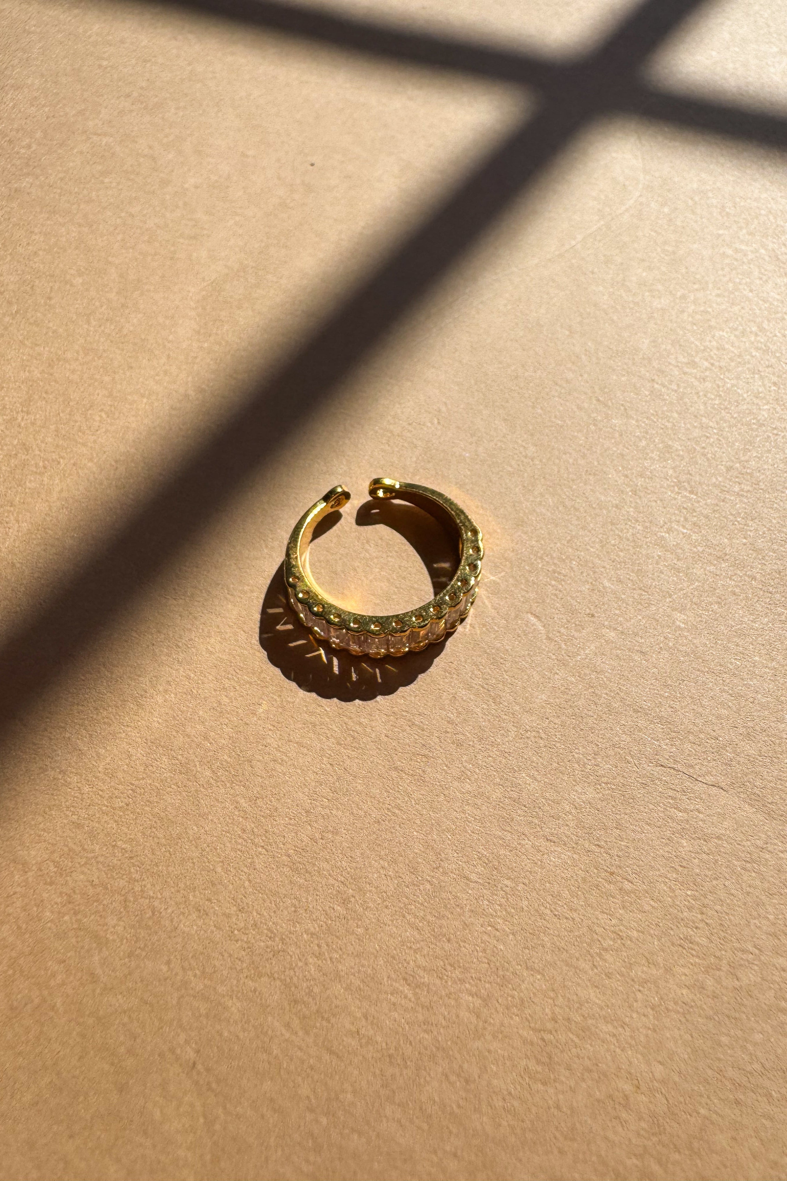 Rima Clear Stone Gold Dipped Ring - flat lay side view
