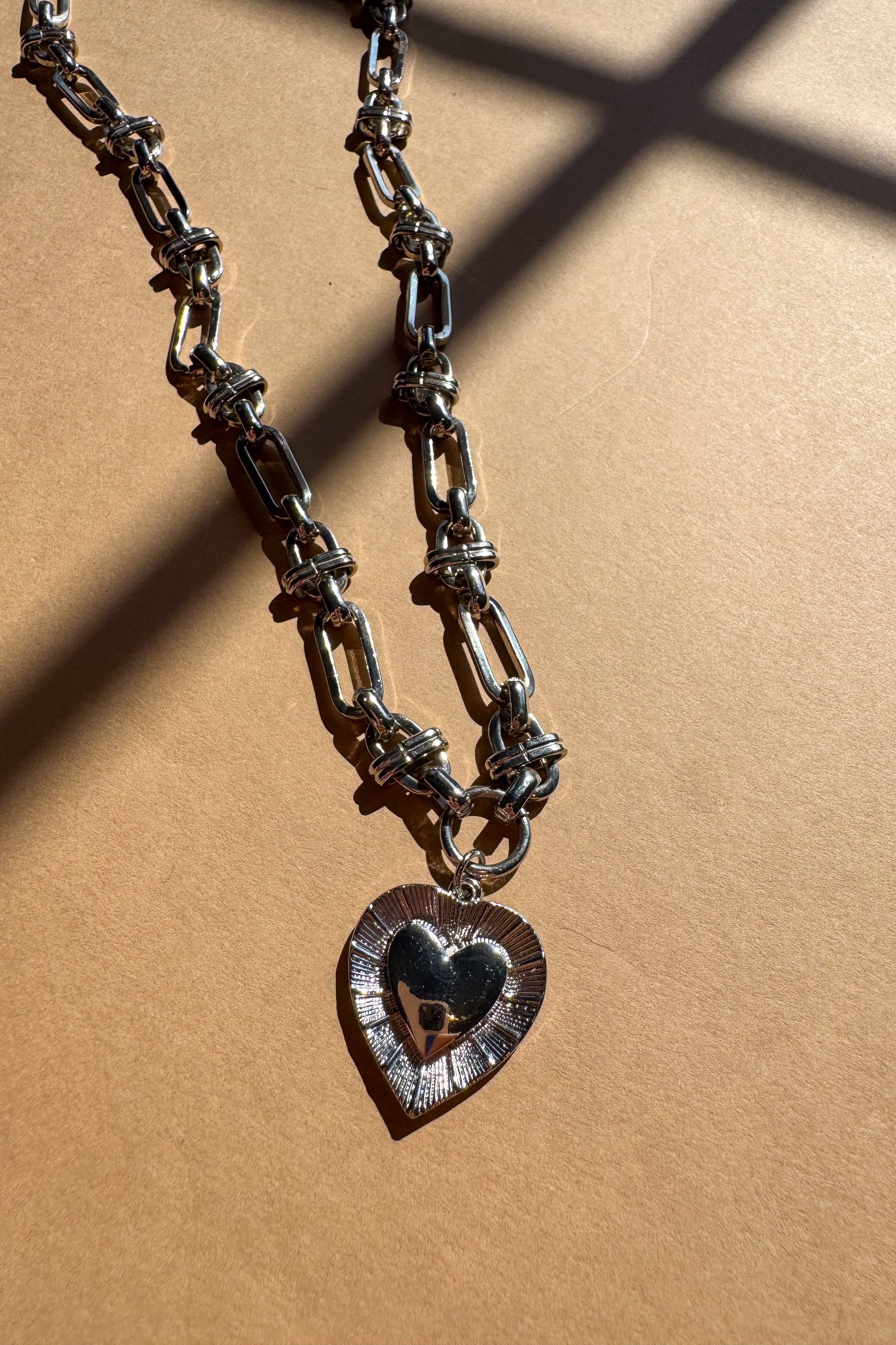 Isla Silver Heart Chain Necklace - flay lay close up