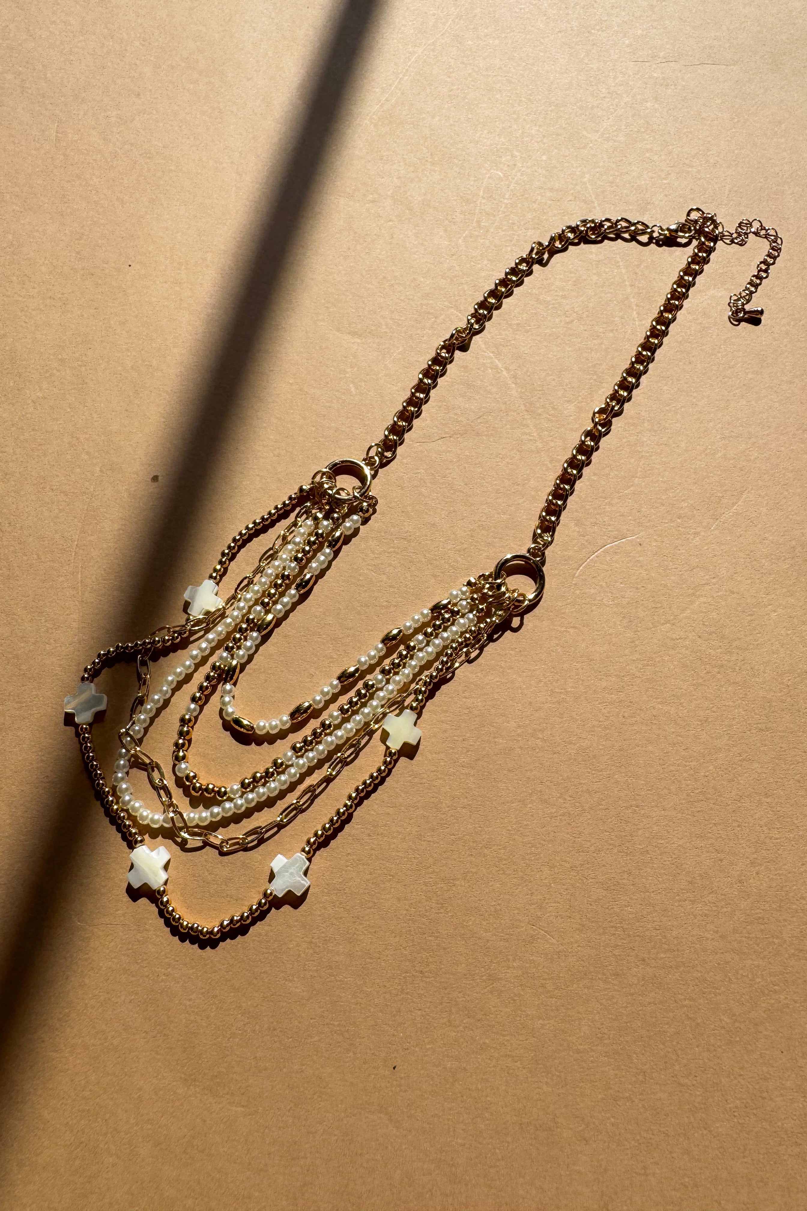 Nyla Gold & Pearl Layered Cross Necklace - flat lay 