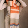 Rylie Orange Striped Fringe Scarf - wrapped around model's neck