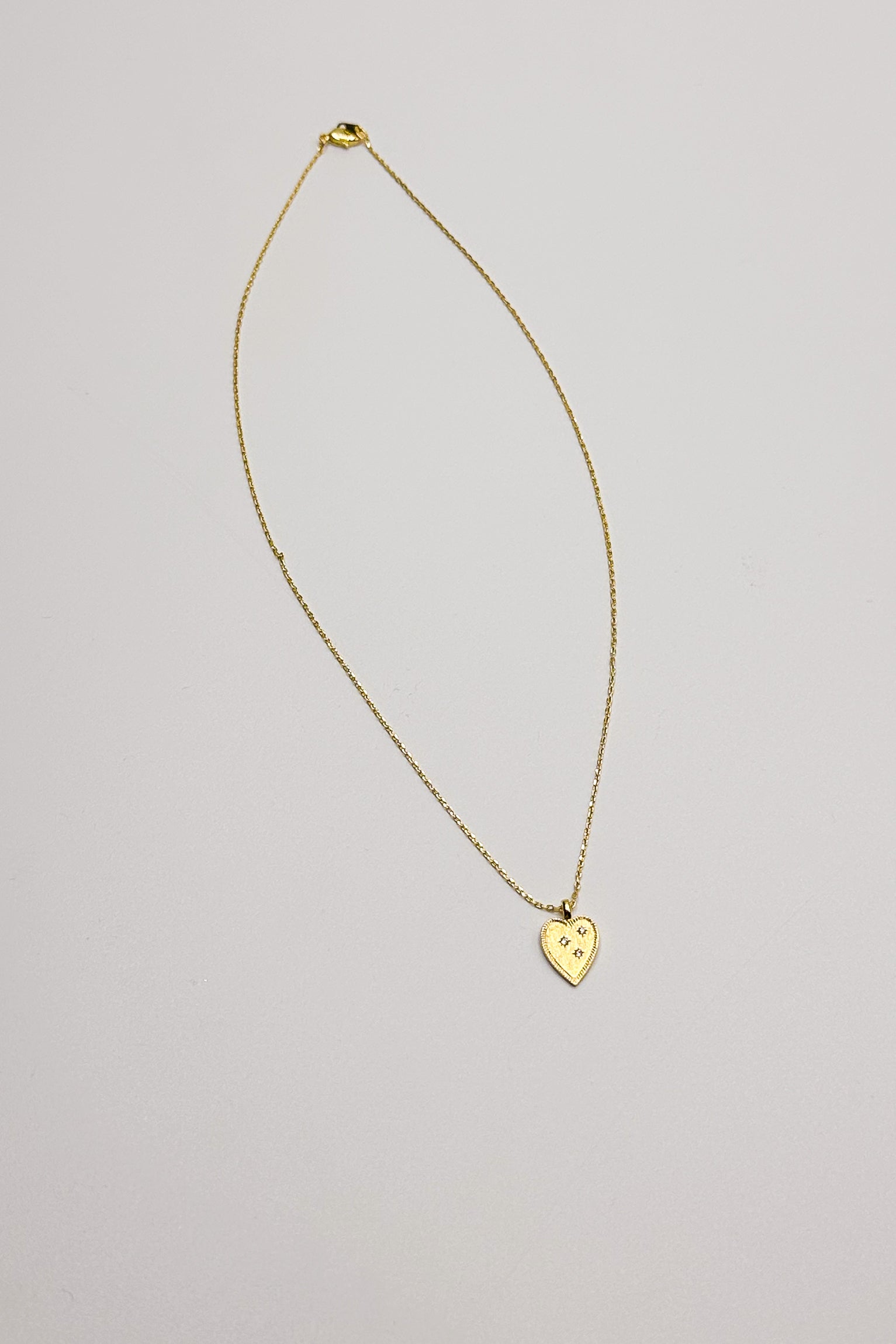 Cora Gold Dipped Heart Necklace- flat lay view