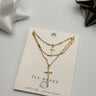 Livia Triple Layer Gold Cross Necklace- close up flat lay view