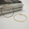 Melania Gold Textured Closed Hoops Earring- close up view