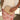 Cove Natural Raffia Woven Clutch Purse - front view being held