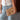 Tessa Natural Woven Collapsible Purse - held by model