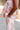 Gianna Cream & Orange Floral Pants - close up side view
